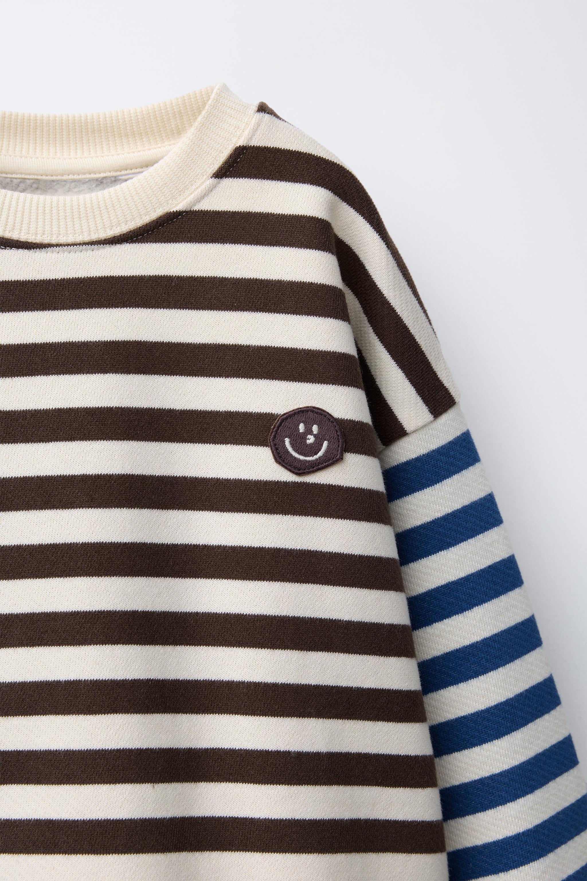 STRIPED SWEATSHIRT WITH FACE PATCH